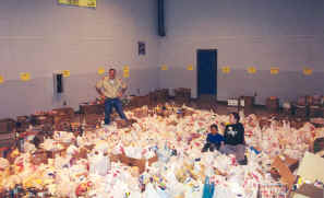 Floor covered by many items collected in Boy Scout Food Drive